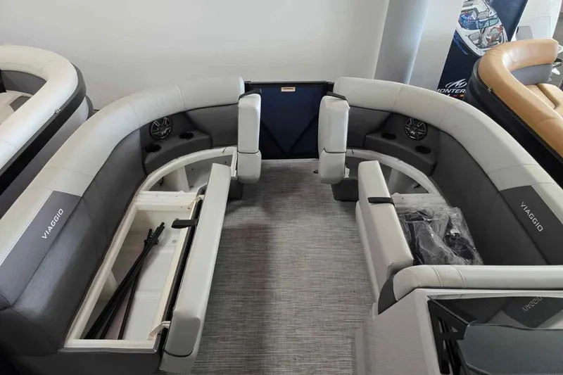 Slide: The Image of 2026 Viaggio V20C boat interior with gray seating and storage compartments. - 5