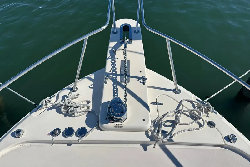 Slide: The Image of Bow of 2024 Grady-White Express 330 boat with anchor and ropes. - 10