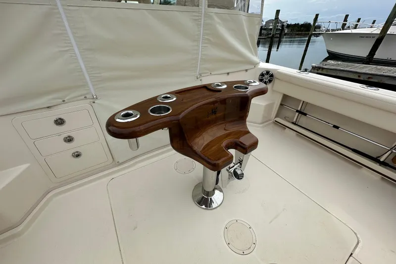 Slide: The Image of 2024 Grady-White Express 330 boat interior with wooden fishing rod holder. - 13