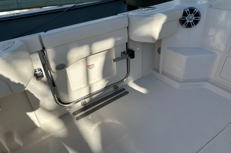 Slide: The Image of 2024 Grady-White Express 330 boat interior with seating and speaker detail. - 15
