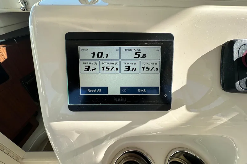 Slide: The Image of Yamaha display on 2024 Grady-White Express 330 showing trip data and fuel usage. - 21