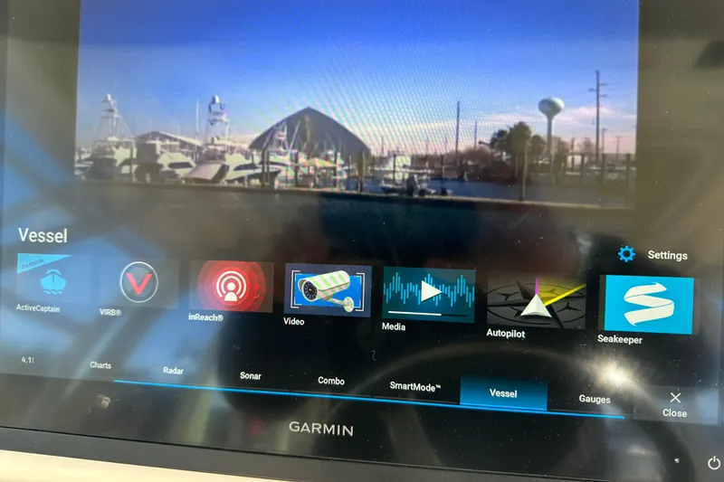 Slide: The Image of Garmin display on 2024 Grady-White Express 330 boat showing vessel controls and settings. - 28