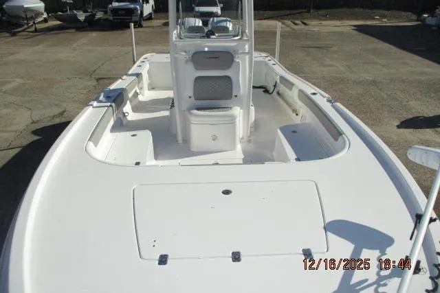 Slide: The Image of 2025 Caymas 281 HB boat, white deck, center console, outdoor setting. - 13