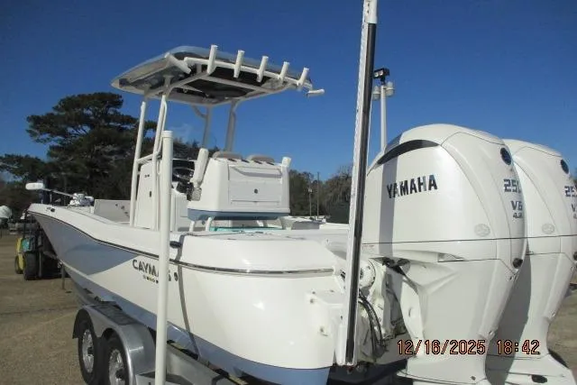 Slide: The Image of 2025 Caymas 281 HB boat with dual Yamaha engines on a trailer. - 5