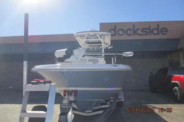 Slide: The Image of 2025 Caymas 281 HB boat at dockside, front view with clear blue sky. - 8