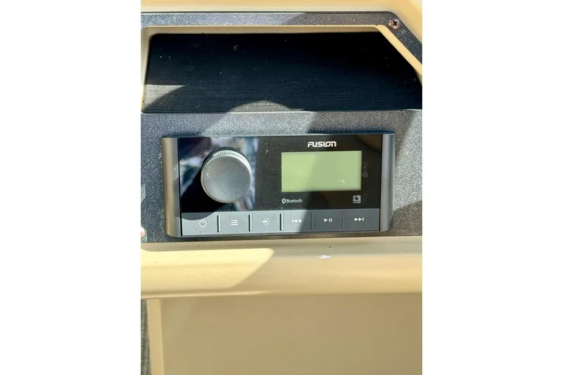 Slide: The Image of Fusion audio system on 2022 Godfrey Sweetwater 2286 C boat dashboard. - 11