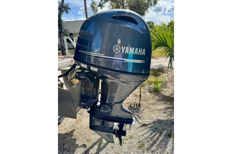 Slide: The Image of Yamaha four-stroke outboard motor on a 2022 Godfrey Sweetwater 2286 C boat. - 16