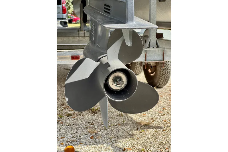 Slide: The Image of Propeller of 2022 Godfrey Sweetwater 2286 C boat on gravel surface. - 19