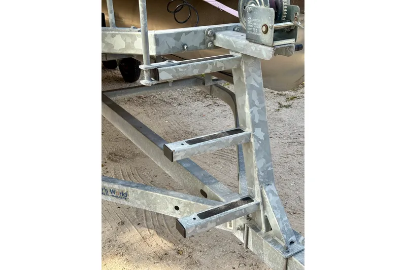Slide: The Image of Trailer frame for 2022 Godfrey Sweetwater 2286 C boat on sandy ground. - 20