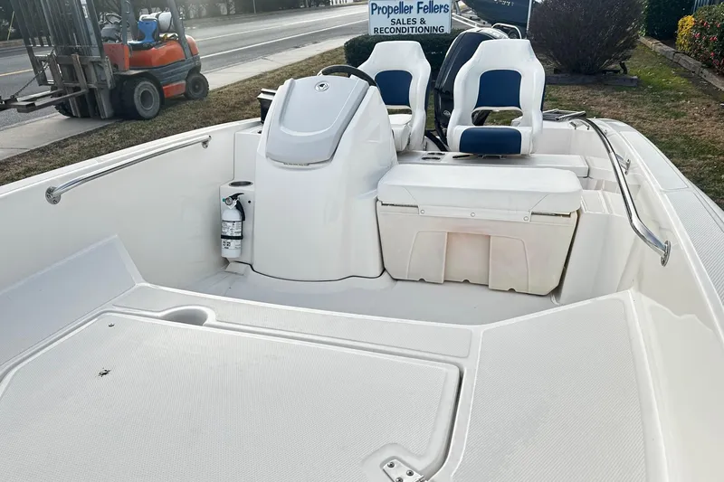 Slide: The Image of 2023 Boston Whaler 160 Super Sport boat interior with seating and storage. - 3
