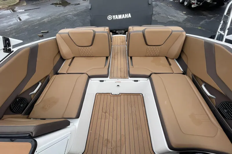 Slide: The Image of 2025 Yamaha Boats 252SD interior with tan seating and wood-style flooring. - 10