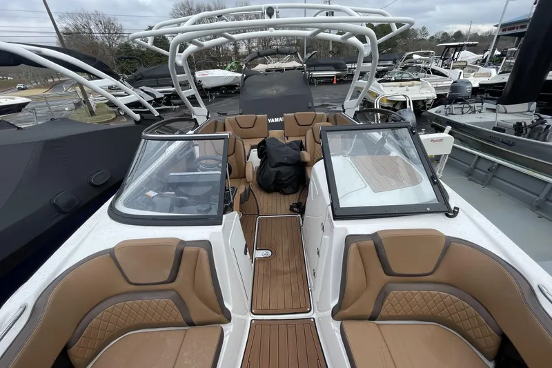 Slide: The Image of 2025 Yamaha Boats 252SD interior with tan seating and sleek design. - 3