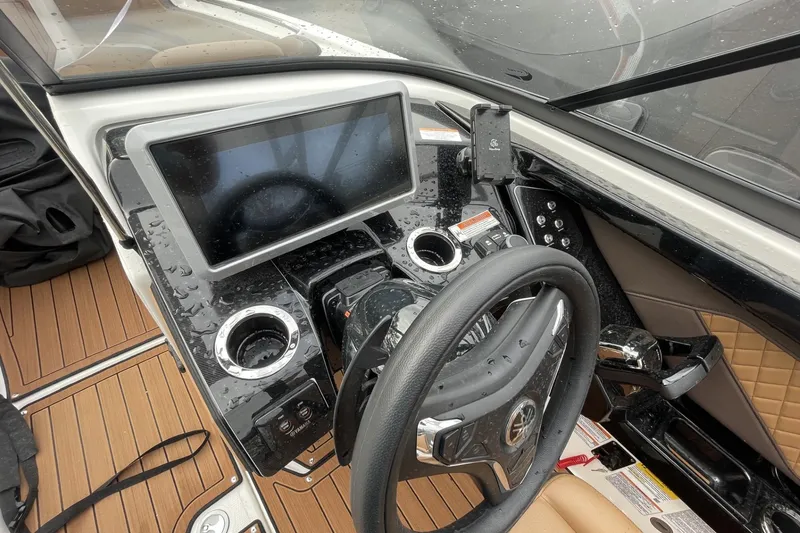 Slide: The Image of 2025 Yamaha Boats 252SD dashboard with steering wheel and touchscreen display. - 6