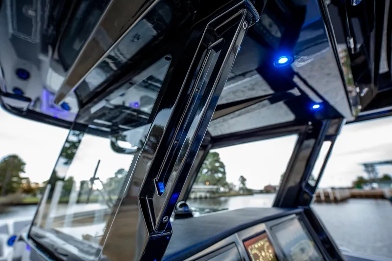 Slide: The Image of 2025 Fountain 38 SCX boat interior with modern design and blue LED lighting. - 18