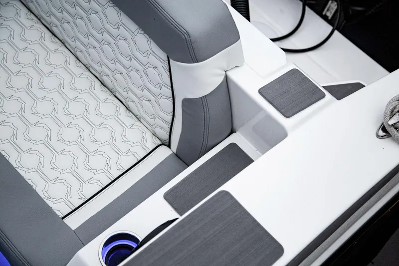 Slide: The Image of 2025 Fountain 38 SCX boat interior with stylish seating and cup holder. - 23