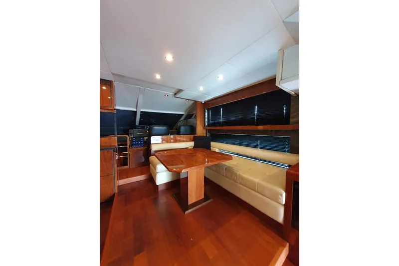 Slide: The Image of Luxurious interior of 2010 Fairline Squadron 55 yacht with wooden flooring and seating area. - 12