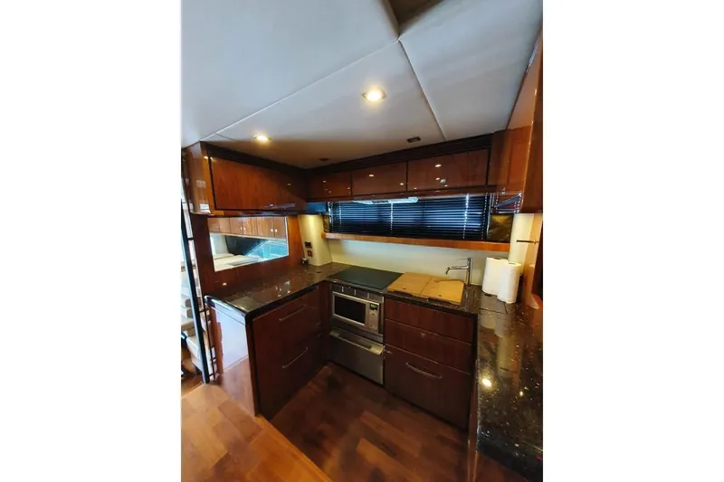 Slide: The Image of Luxurious kitchen interior of 2010 Fairline Squadron 55 yacht with modern amenities. - 14