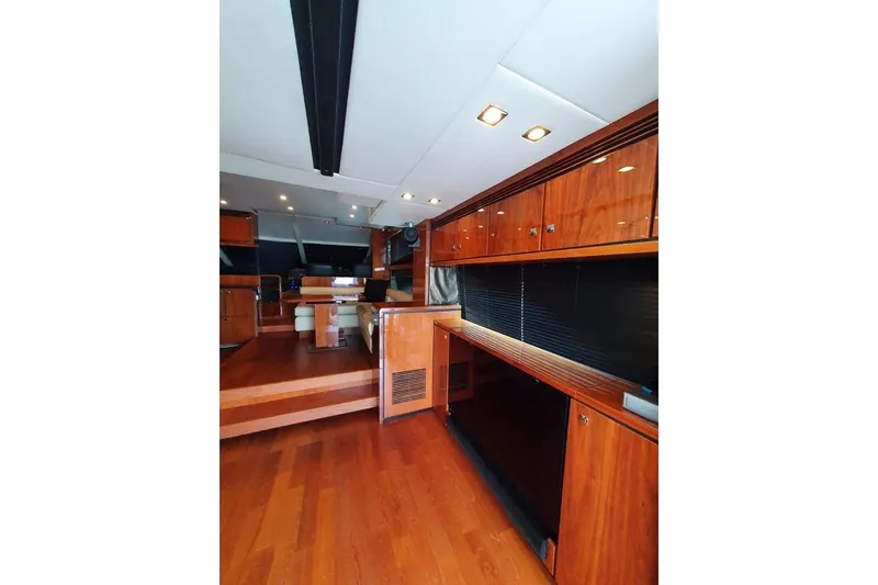 Slide: The Image of Luxurious interior of 2010 Fairline Squadron 55 yacht with wooden cabinetry and seating area. - 15