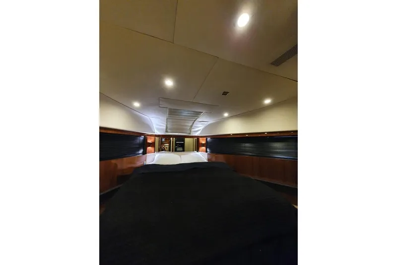 Slide: The Image of Luxurious interior cabin of 2010 Fairline Squadron 55 yacht, featuring elegant wood paneling. - 17
