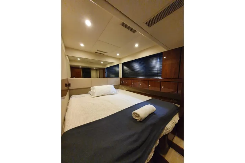 Slide: The Image of Luxurious cabin interior of 2010 Fairline Squadron 55 yacht with cozy bedding. - 19