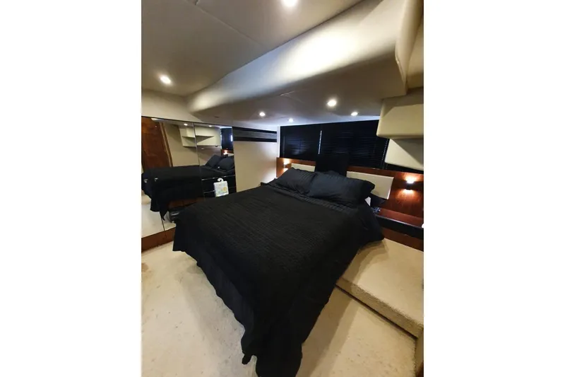 Slide: The Image of Luxurious bedroom interior of 2010 Fairline Squadron 55 yacht with elegant black bedding. - 22