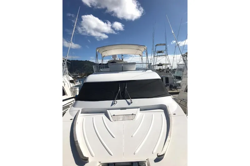 Slide: The Image of 2010 Fairline Squadron 55 yacht docked under a clear blue sky. - 3