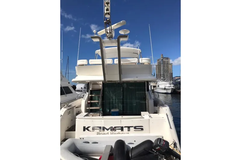 Slide: The Image of 2010 Fairline Squadron 55 yacht docked at marina under clear blue sky. - 5