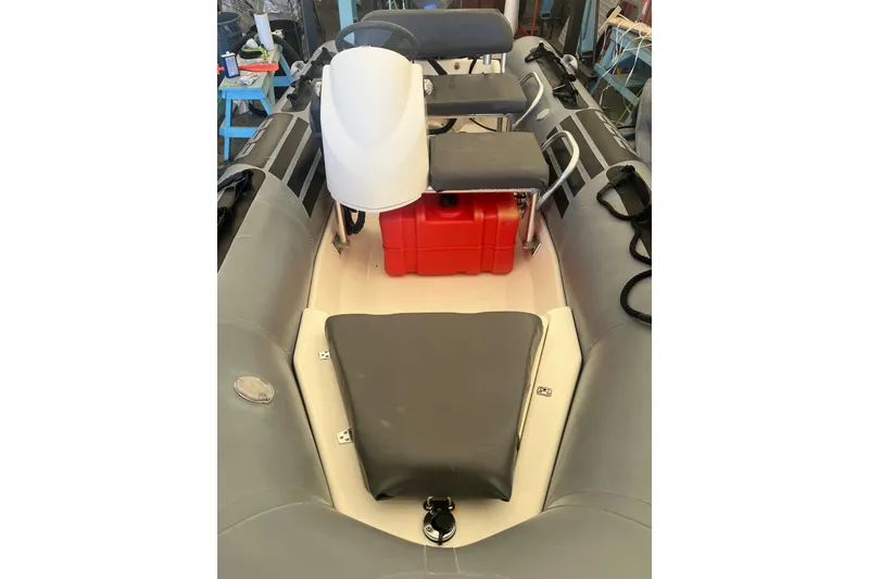 Slide: The Image of 2010 Zodiac Bayrunner 420 inflatable boat interior with seating and red fuel tank. - 5