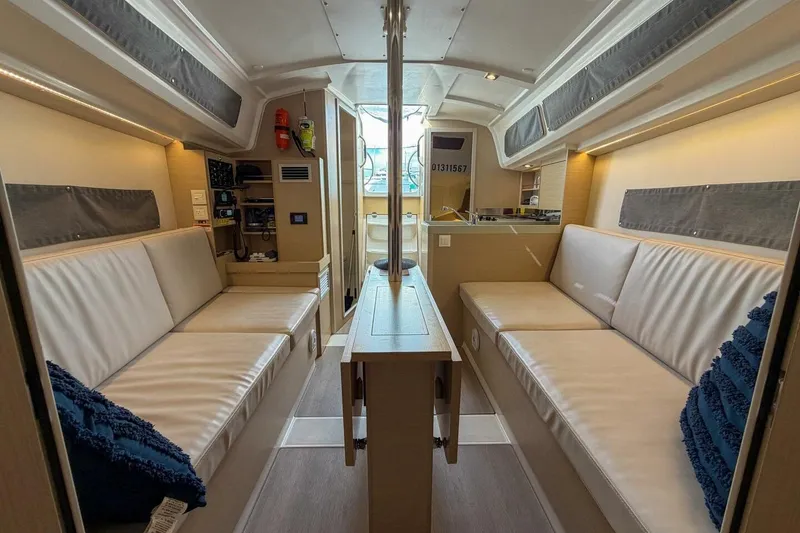Slide: The Image of Interior of 2021 Beneteau Oceanis 30.1 yacht with modern seating and navigation equipment. - 17