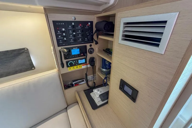 Slide: The Image of Control panel and storage in 2021 Beneteau Oceanis 30.1 yacht interior. - 23