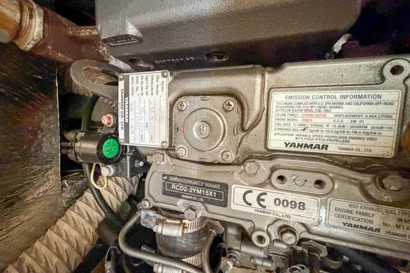Slide: The Image of Engine compartment of a 2021 Beneteau Oceanis 30.1 sailboat, featuring Yanmar engine details. - 28