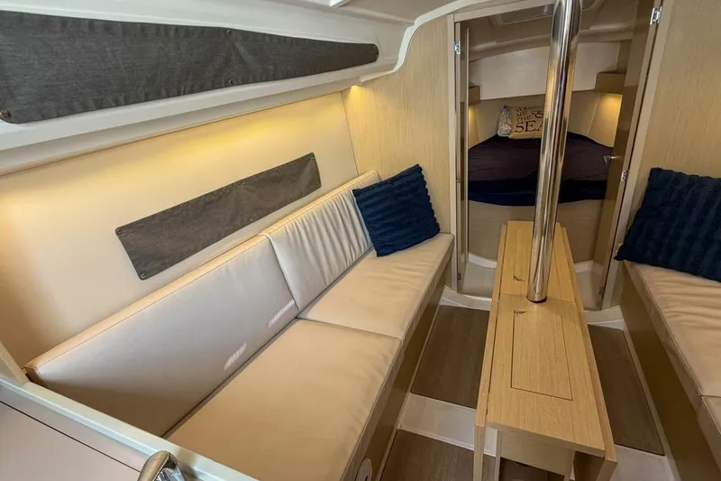 Slide: The Image of Interior of 2021 Beneteau Oceanis 30.1 yacht with cozy seating and modern design. - 3