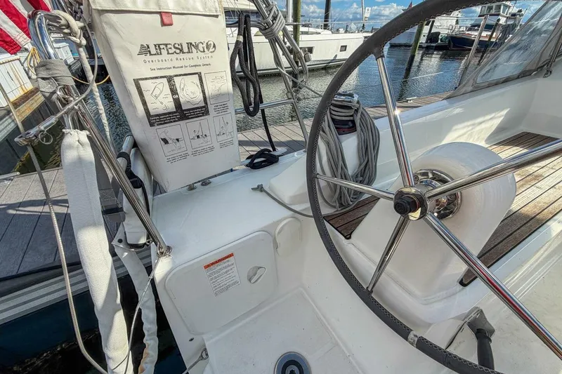 Slide: The Image of Beneteau Oceanis 30.1 yacht cockpit with steering wheel and Lifesling rescue system, 2021 model. - 42
