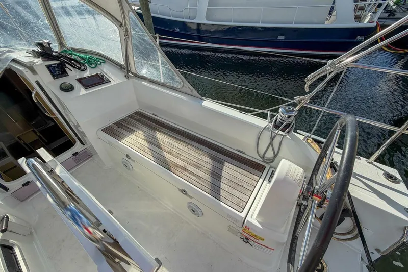 Slide: The Image of Cockpit of 2021 Beneteau Oceanis 30.1 sailboat with steering wheel and seating. - 45