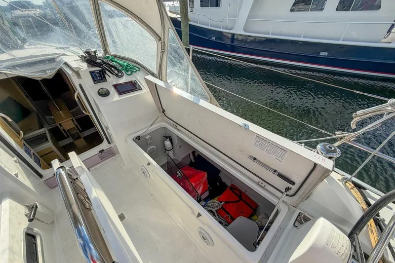 Slide: The Image of Beneteau Oceanis 30.1 sailboat cockpit with open storage, showcasing modern design and equipment. - 46