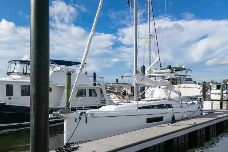Slide: The Image of 2021 Beneteau Oceanis 30.1 sailboat docked at marina under blue sky. - 50