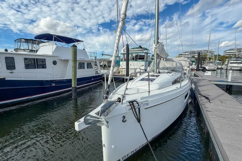 Slide: The Image of 2021 Beneteau Oceanis 30.1 sailboat docked at marina under blue sky. - 52