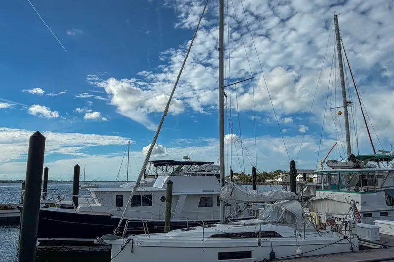 Slide: The Image of Beneteau Oceanis 30.1 sailboat docked at marina under blue sky, 2021 model. - 55