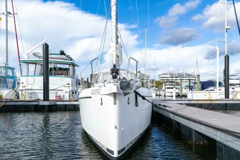 Slide: The Image of 2021 Beneteau Oceanis 30.1 yacht docked at marina under blue sky. - 59