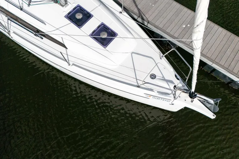 Slide: The Image of Aerial view of 2021 Beneteau Oceanis 30.1 sailboat docked on calm water. - 63