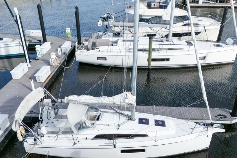 Slide: The Image of 2021 Beneteau Oceanis 30.1 sailboat docked at marina, aerial view. - 64