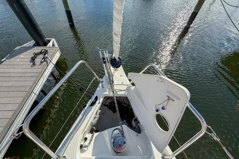 Slide: The Image of Beneteau Oceanis 30.1 sailboat bow, docked, with open anchor locker, 2021 model. - 74