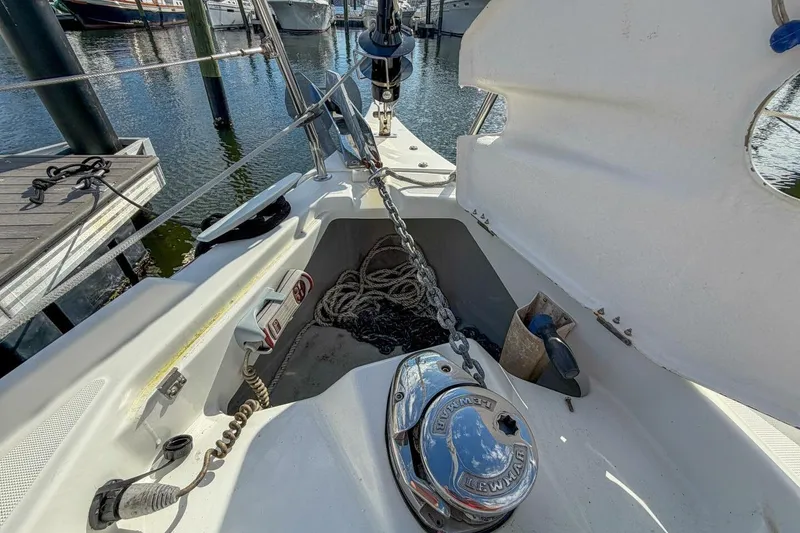 Slide: The Image of Beneteau Oceanis 30.1 sailboat deck with anchor chain and winch, 2021 model. - 75