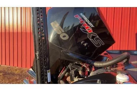 Slide: The Image of 2020 Bass Cat Eyra Premium with Mercury Pro XS engine against red background. - 1