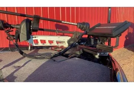 Slide: The Image of 2020 Bass Cat Eyra Premium boat with Humminbird equipment, red background. - 4