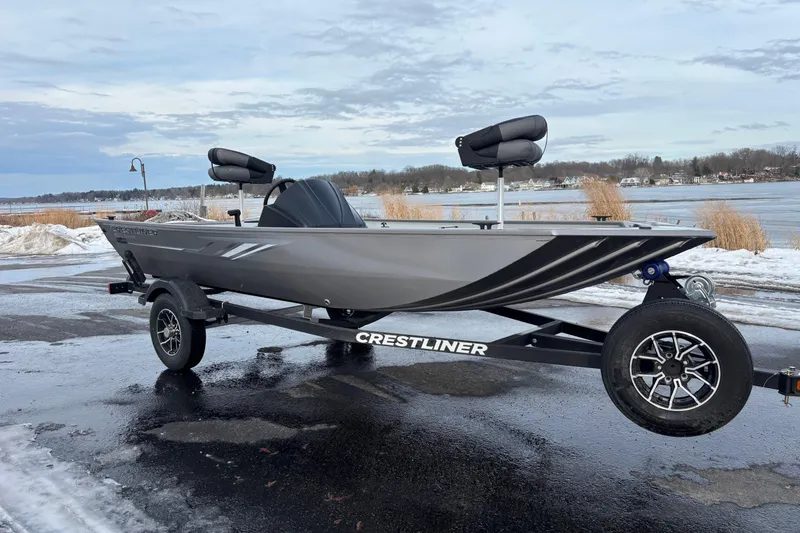 Slide: The Image of 2026 Crestliner 1600 Storm boat on trailer by snowy lakeside. - 3