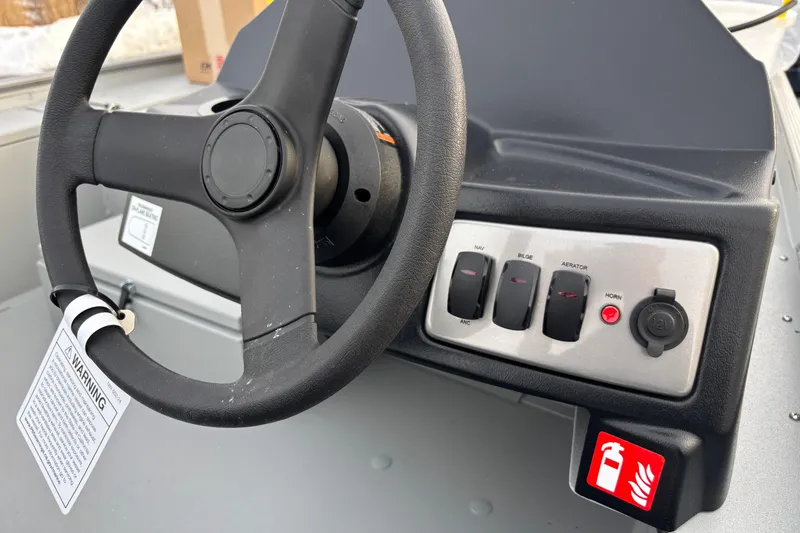 Slide: The Image of Steering wheel and control panel of 2026 Crestliner 1600 Storm boat. - 6