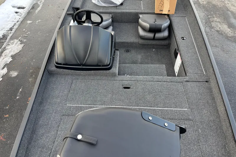 Slide: The Image of 2026 Crestliner 1700 Storm boat interior with steering wheel and seating. - 8