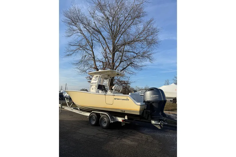 Slide: The Image of 2015 Sportsman Heritage 251 Center Console boat interior with helm and seating. - 5