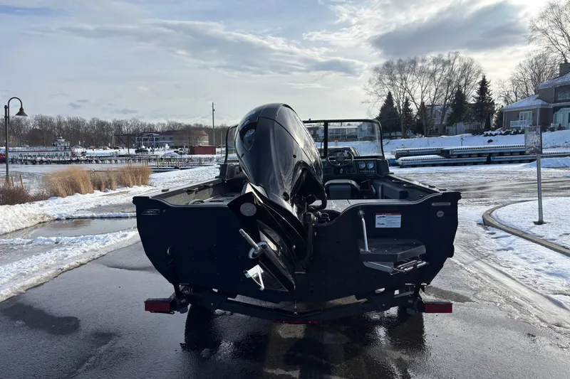 Slide: The Image of 2026 Crestliner 1850 Fish Hawk WT JS boat at snowy dockside. - 14